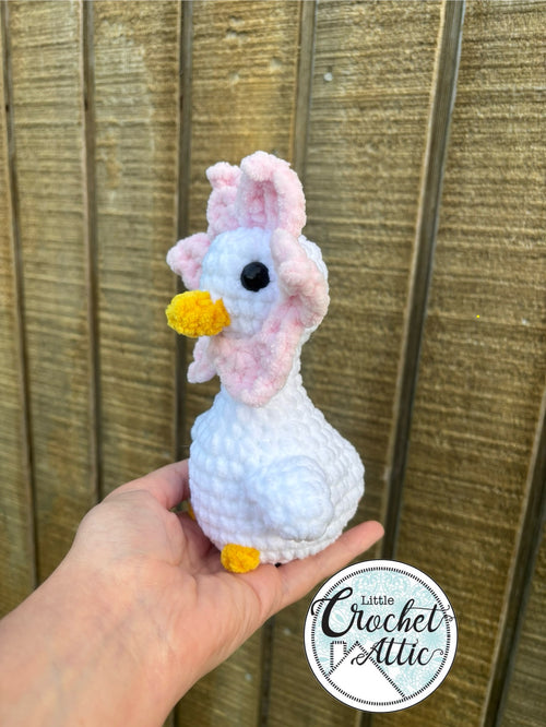 Geese with pink flower hat